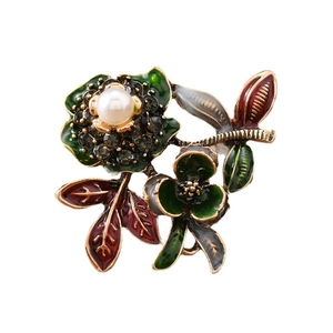 Elegant peony flower brooch with enamel leaves and a large pearl center in gold finish