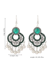 Detail view of silver boho earrings with green stone and measurements 7cm by 3.3cm