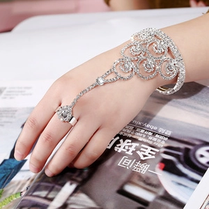 Detailed view of silver rhinestone hand harness with floral cuff and matching ring set