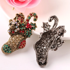 Vintage Christmas stocking brooch with bear and rhinestones, front and back views