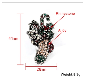 Detailed macro view showing the 41mm by 28mm dimensions of the Christmas stocking brooch