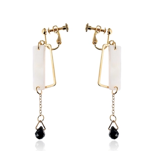 Modern geometric clip-on earrings with gold frame, shell plate and black crystal drop