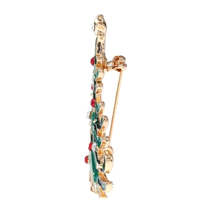 Detailed side view of Christmas tree brooch with green enamel and sparkling rhinestones