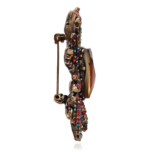 Broche vintage en forme d'insecte avec strass colorés et pierre centrale ambre