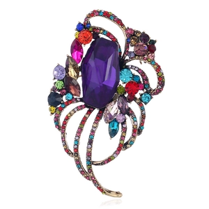 Retro hollow brooch with a purple shield gemstone and colorful rhinestones in gold