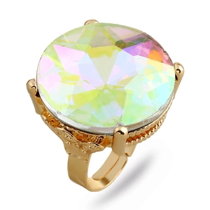 Macro shot of gold vintage ring featuring large aurora borealis crystal with ornate details