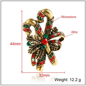 Retro Christmas candy cane brooch with bow and rhinestones, sized 44mm by 32mm