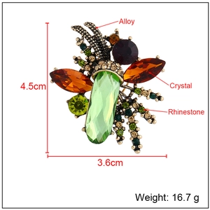 Vintage insect brooch with olive green crystal and rhinestones, size 4.5cm by 3.6cm
