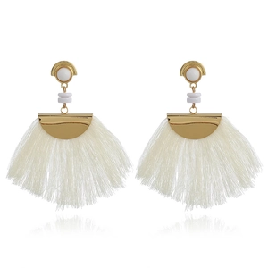 Detailed close-up of bohemian fan-shaped earrings with white silk tassels and gold beads