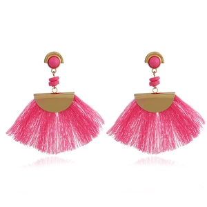 Detailed view of pink fan-shaped tassel earrings with gold-toned metal and pink beads