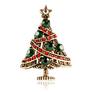 Vintage-Gold-Weihnachtsbaumbrosche mit smaragdgrünen Strasssteinen und Stern