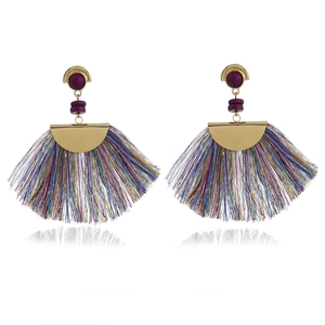 Detailed shot of bohemian fan-shaped earrings with purple beads and colorful silk tassels
