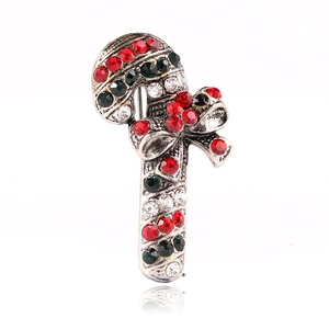 Sparkling Christmas candy cane brooch with red and green rhinestones and a silver bow