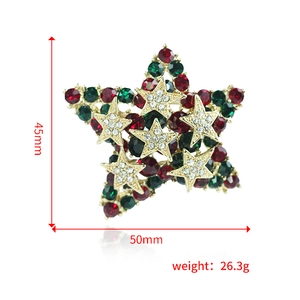 Broche étoile de Noël avec strass rouges et verts en finition dorée élégante