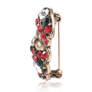 Detailed side view of vintage Santa brooch showing secure alloy pin fastener and rhinestones
