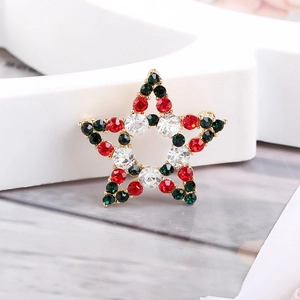 Detailed view of Christmas star brooch with red, green and white inlaid crystals