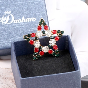 Exquisite Christmas hollow star brooch with red and green crystals in blue gift box