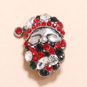 Vintage silver Santa Claus brooch featuring sparkling red and green rhinestones ornament