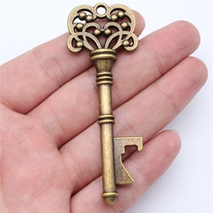 Retro bronze alloy key bottle opener with heart hollow design and antique finish