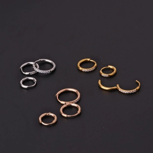 Polished stainless steel huggie earrings with cubic zirconia in gold silver rose gold