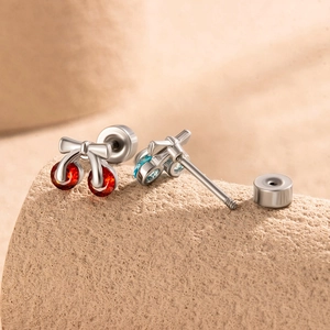 Sweet cherry stud earrings with bow and screw-back design in red and blue colors