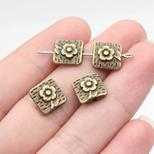 Vintage bronze square flower spacer beads for DIY jewelry making on silver wire