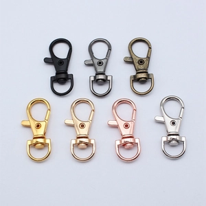 Rotating metal lobster clasps in seven colors with 360-degree D-rings on white background