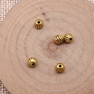 Five vintage gold pumpkin beads with vertical stripes for DIY jewelry making