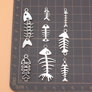 Set of 8 antique silver fish bone pendants in various designs for DIY jewelry making