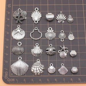 Set of 19 antique silver sea shell and starfish pendants for DIY jewelry making