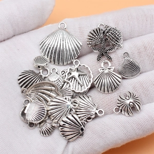 Set of 20 vintage silver alloy sea shell and starfish charms for DIY jewelry making