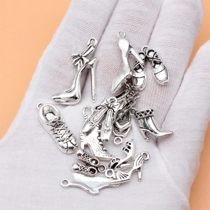 Set of 14 silver metal shoe charms including heels and sneakers for DIY jewelry