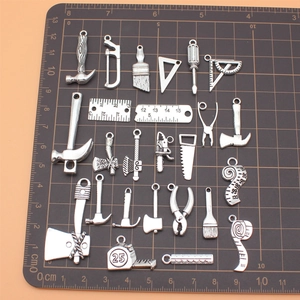 25-piece vintage silver alloy tool charm set with hammers saws and wrenches for DIY crafts
