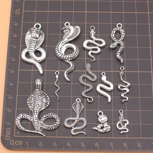 Set of 11 antique silver snake charms in various designs for DIY jewelry making
