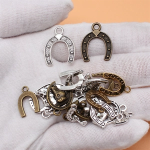 Set of 20 assorted metal horseshoe lucky charms in silver and bronze for DIY jewelry