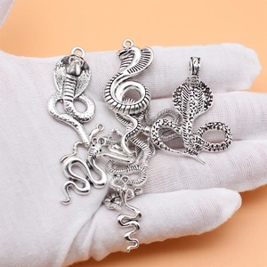 Set of 12 antique silver snake charms in various styles for DIY jewelry making