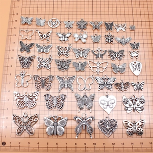 Set of 48 antique silver butterfly pendants in various sizes for DIY jewelry making