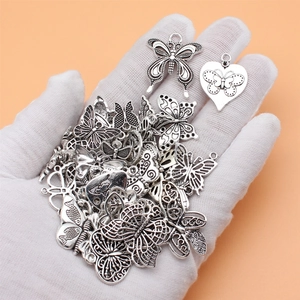 Set of vintage silver butterfly and heart alloy charms for DIY jewelry making