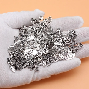 Set of 48 vintage silver butterfly charms in various styles for DIY jewelry making