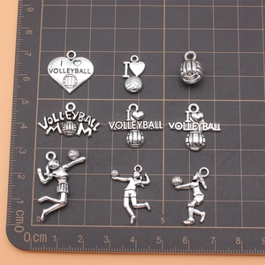 Antique silver volleyball charms set with heart shapes and female player figures