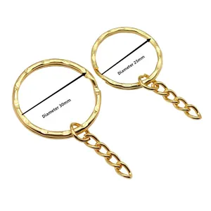 Detail showing 25mm and 30mm golden metal key rings with short chain attachments