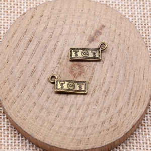 Vintage bronze dollar sign charm pendants for DIY jewelry making accessories set