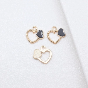 Three gold heart alloy pendants with black enamel and twisted rope texture for DIY jewelry