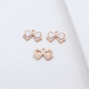 DIY bow-shaped charms with colorful enamel finish and gold-plated edges for jewelry making