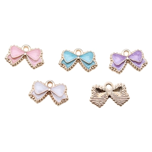 Colorful enamel bow charms in pink, blue, purple, and white for DIY jewelry making