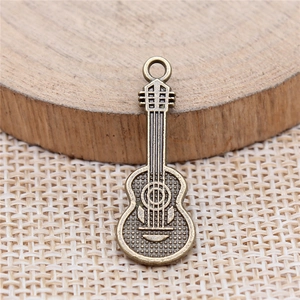 Antique bronze guitar pendant for DIY jewelry making with detailed metal craftsmanship