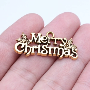 Merry Christmas DIY metal pendant in vintage gold with holly leaf accents and top loop