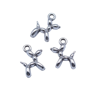 Three shiny silver balloon dog pendants for DIY jewelry making in polished metal