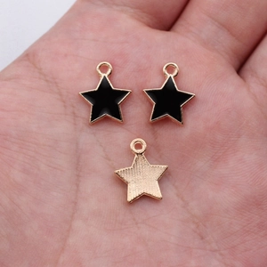 Star-shaped alloy pendant with black enamel finish and gold-tone frame for DIY jewelry