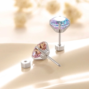 Two-tone rose cut zircon titanium steel screw back earrings on golden silk background
